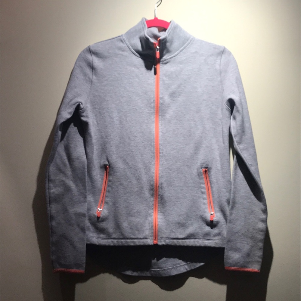 Women’s athletic jacket with thumb holes.